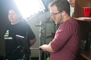 Director Jonothan Carpenter checks the monitor to frame a shot.